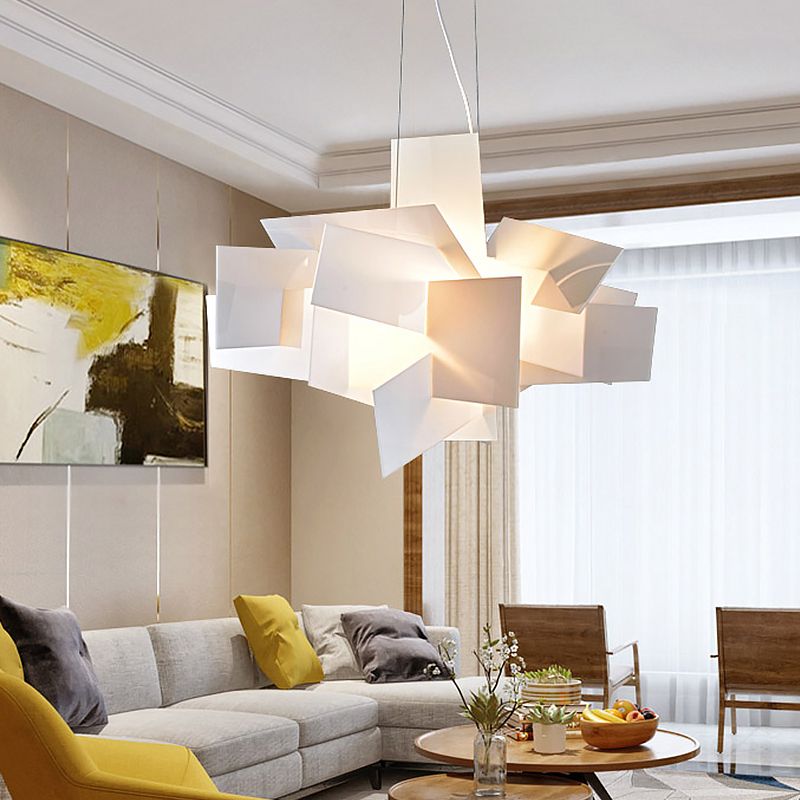 White layered pendant above a living-room table