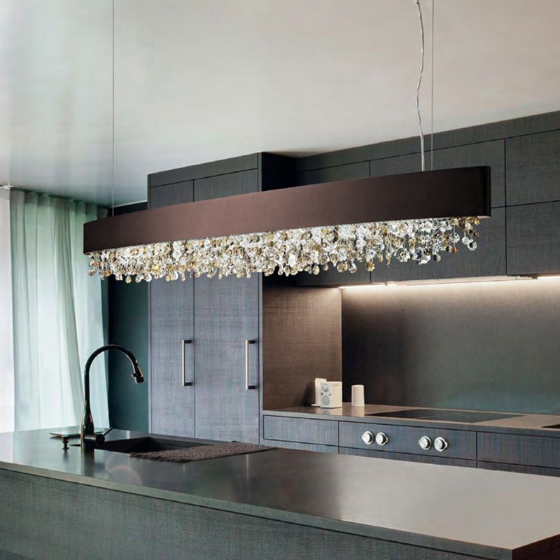 Brown linear crystal pendant above a kitchen island