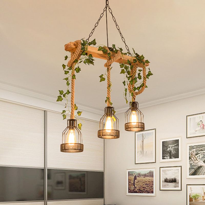 Three-light Alessio wood-beam pendant lit in a living room.