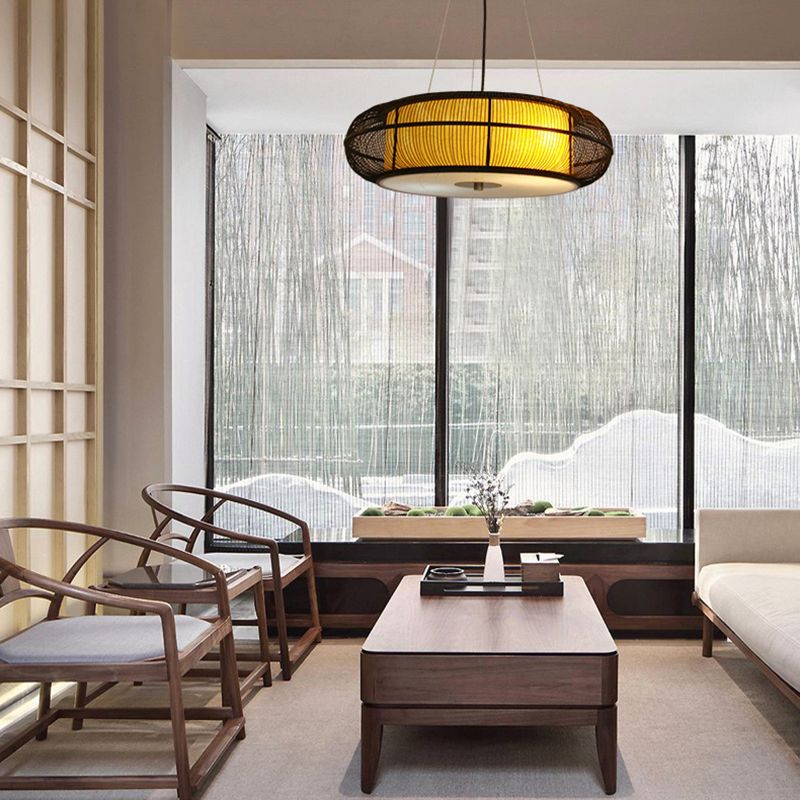 Ozawa black-rim woven pendant above a living room tea table