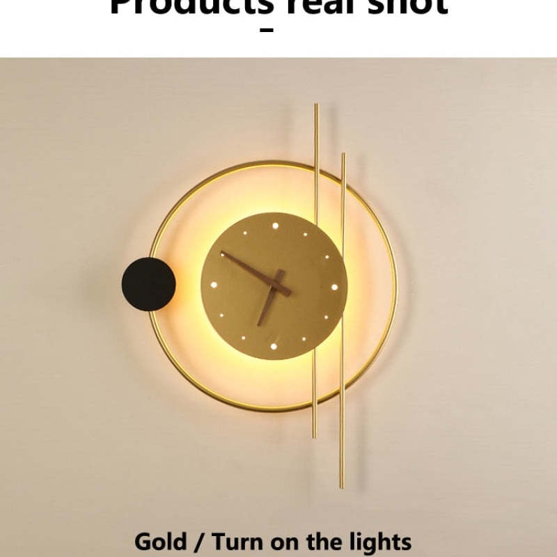Gold Nielsen clock shown with its light switched on