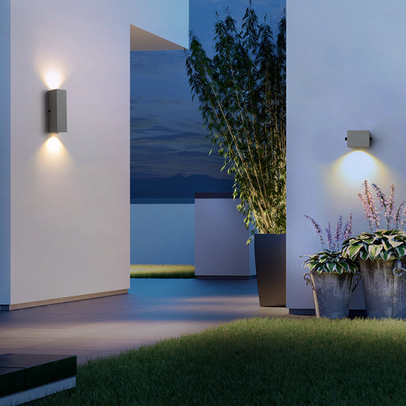 Cement wall lights in an outdoor garden scene