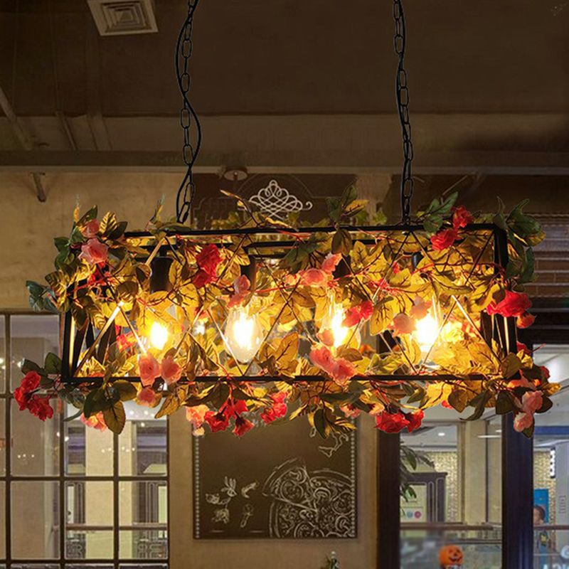 Illuminated metal-frame pendant surrounded by autumn-colored leaves