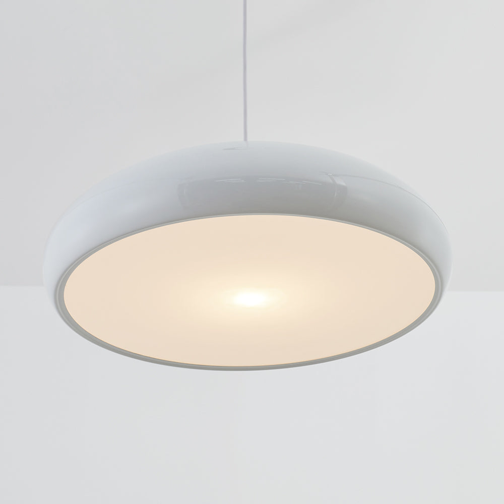 Close underside view of the white dome with a broad pale panel and glossy rounded rim