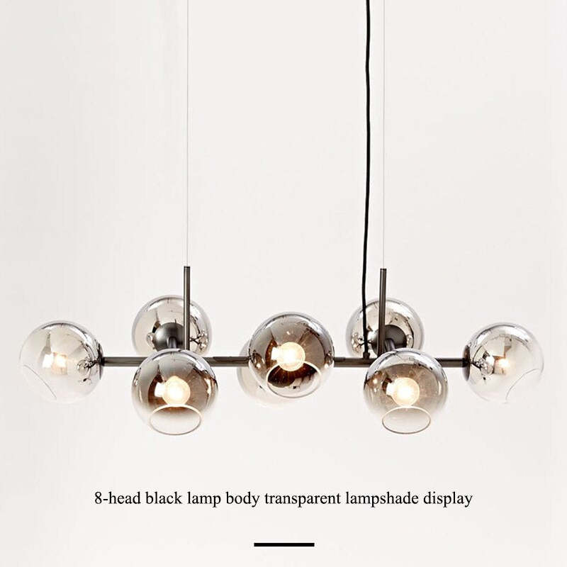 Black Valentina pendant with reflective glass globes and lit bulbs, with an eight-head caption
