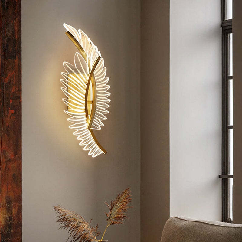 Kristy double-wing wall light near a window above decorative grass and seating