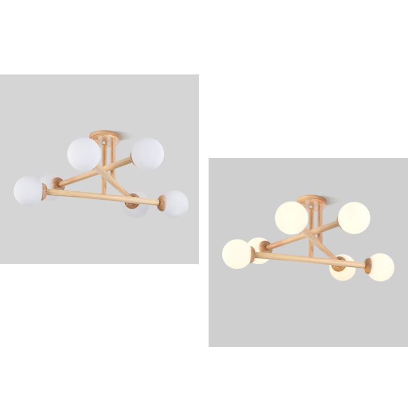 Two views of a six-globe wooden ceiling light with unlit and lit shades
