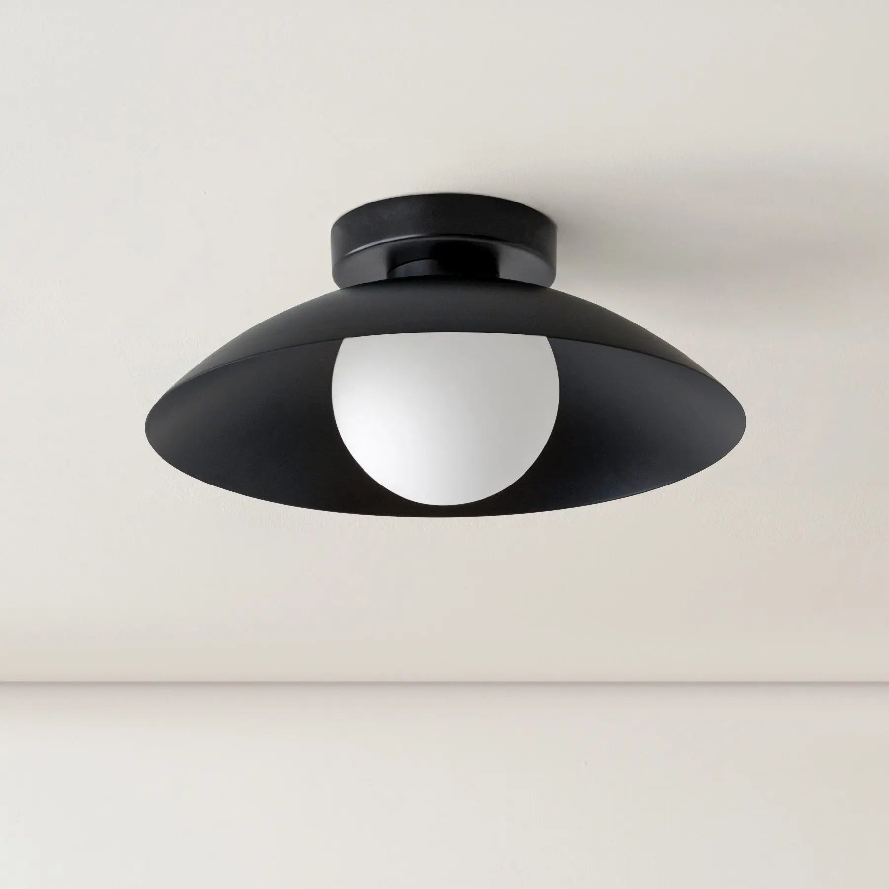Black Cairns ceiling lamp with a white globe diffuser