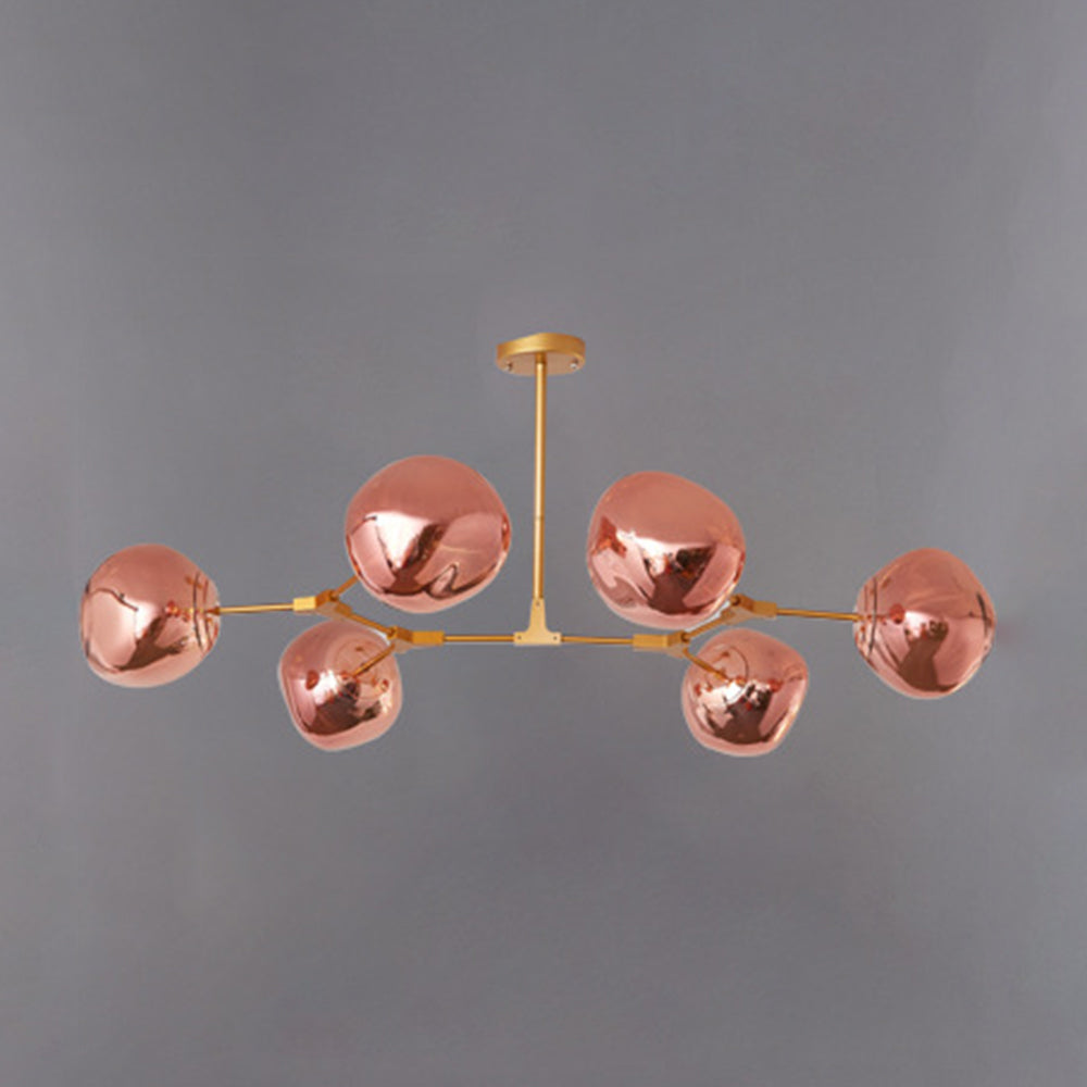 Mirza six-light Rose Gold reflective globes on a gold-tone frame, unlit against grey