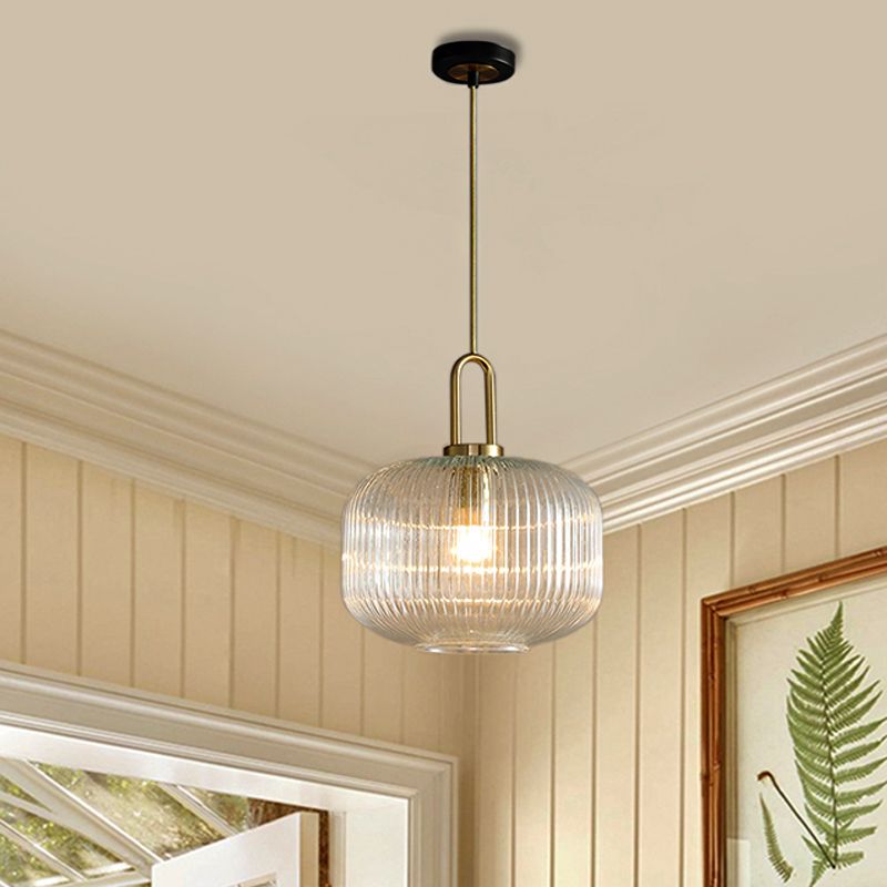 Broad cylindrical Sanna ribbed glass pendant in a light interior