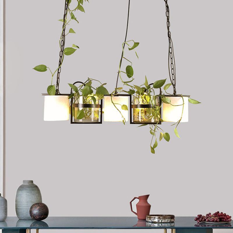 Nest black pendant pictured above a long cabinet