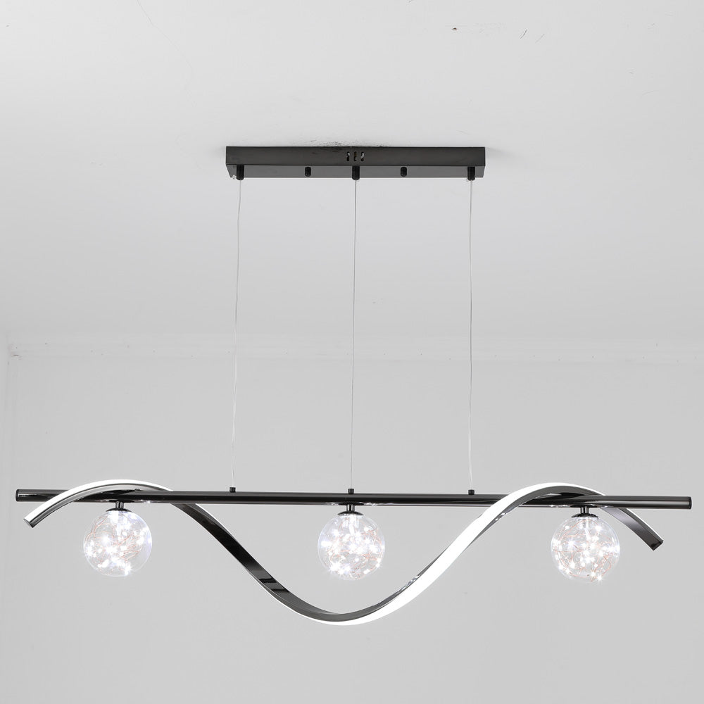 Black LED wave and three lit globes against a pale room