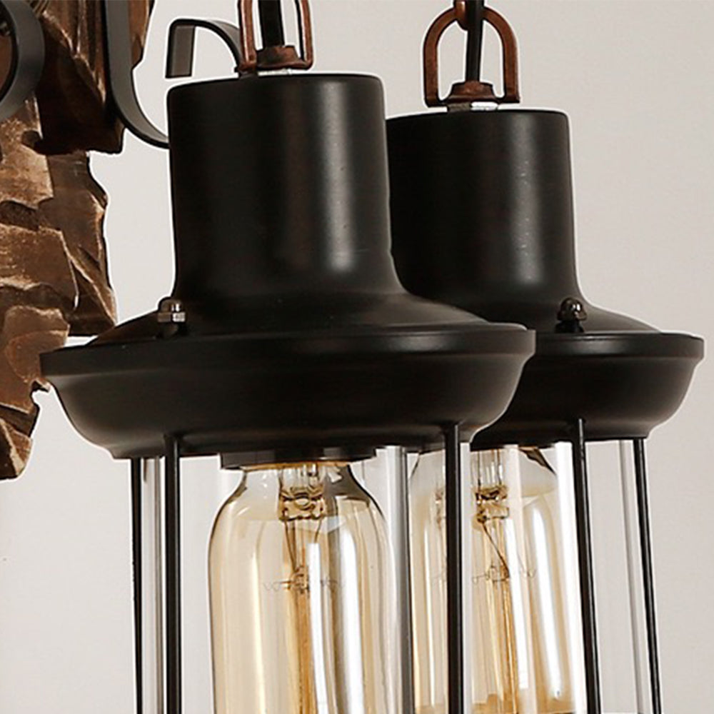 Close-up of two Austin lantern housings with dark metal caps and visible bulbs.