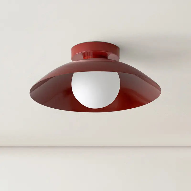 Red ceiling-light shade and central white globe