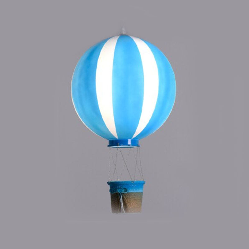 Blue balloon pendant with pale vertical stripes and a blue-rimmed decorative basket tied with a bow
