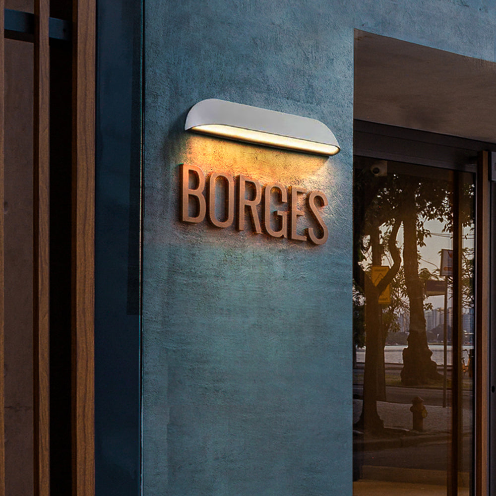 White Orr wall light above exterior lettering