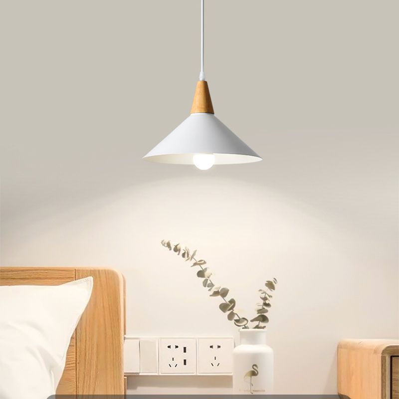 One-light Morandi white cone pendant above a bedside area