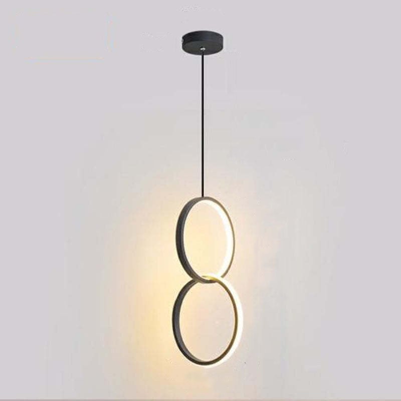 Two vertically stacked dark-rim circular light elements suspended below a round black canopy