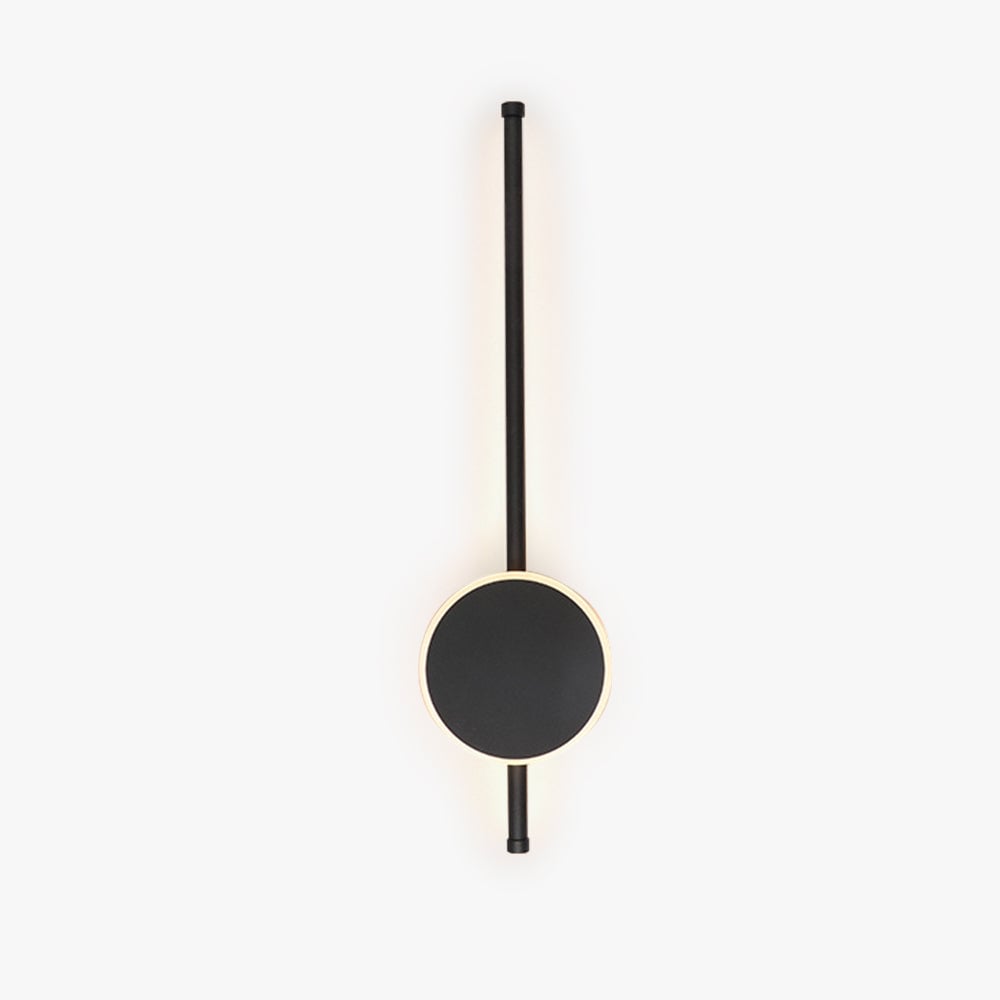 Unlit black disc and slender rod on a pale background