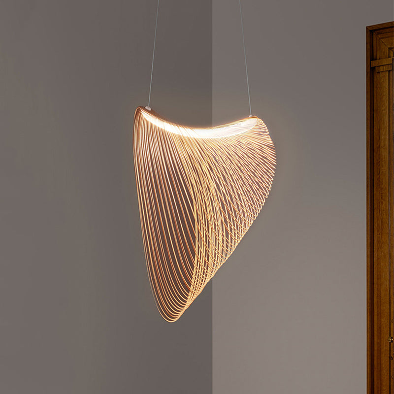 Front view of an illuminated Ozawa wood-slat pendant on two slim suspension lines beside a doorway