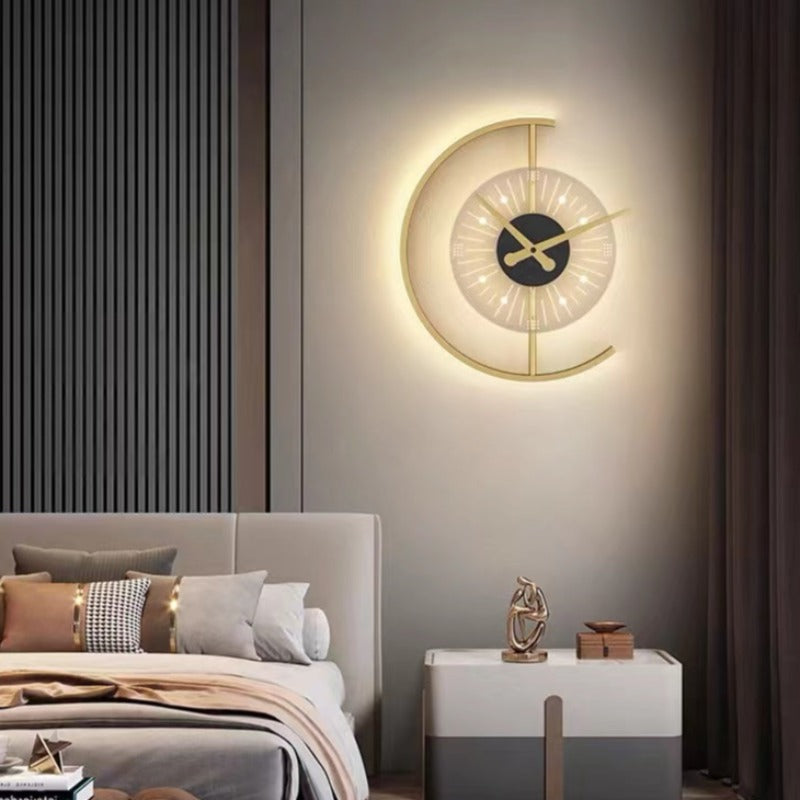 Nielsen illuminated clock wall light above a nightstand beside a grey bed and dark slatted wall