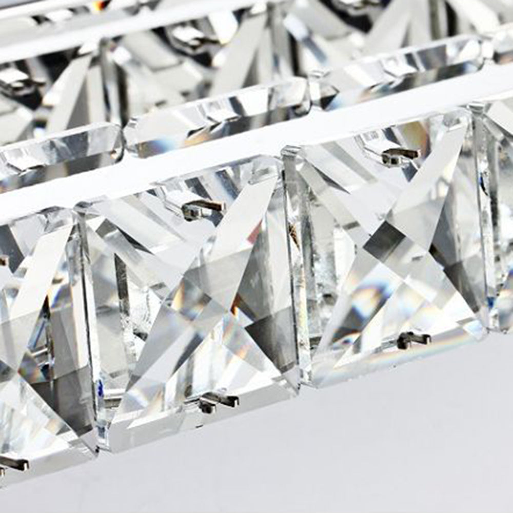Kristy clear faceted crystal blocks in two rows with small retaining clips beside a central metal rail