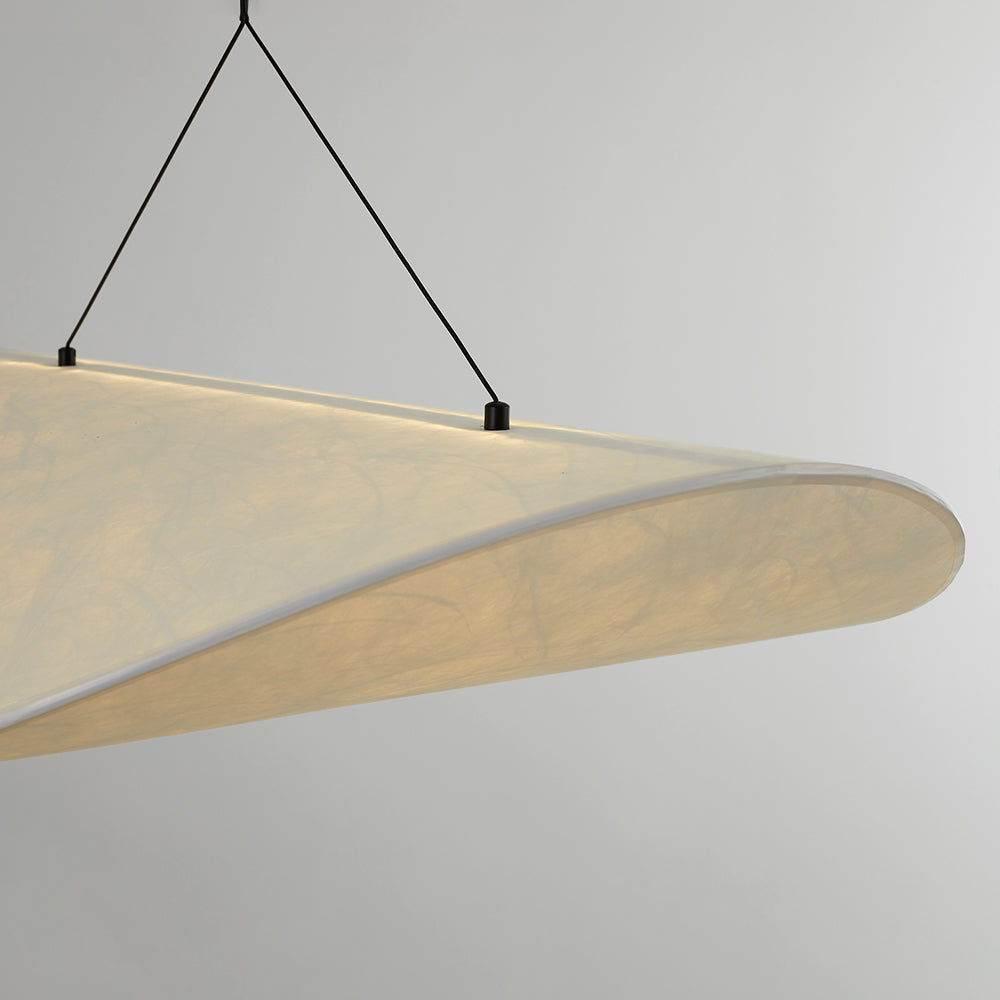 Close-up of the glowing curled shade edge and two dark suspension attachment points