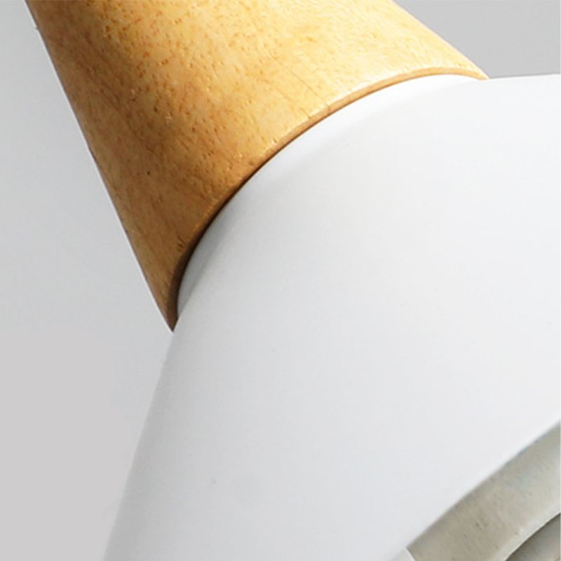 Close view of tan wood-look cone accent and white metal shade