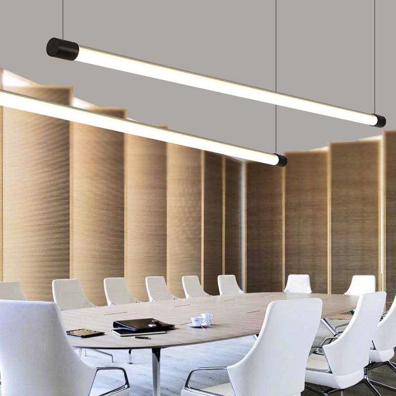 Two black-ended tube pendants over a long meeting table with white chairs