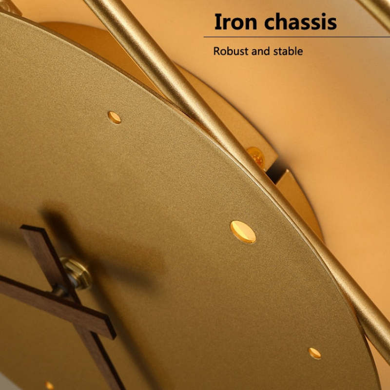 Close view of the gold-tone Nielsen dial, clock hands and curved frame