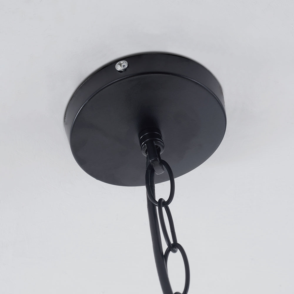 Close black Alessio ceiling plate with a central chain connector, side fastener and oval chain links