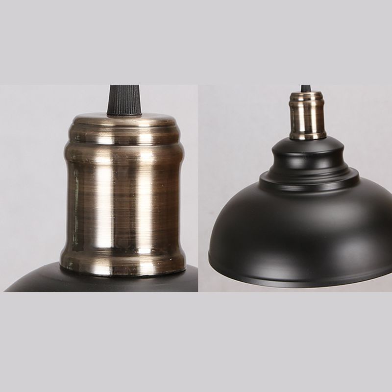 Two detail views of a black dome pendant and its contrasting metallic upper fitting