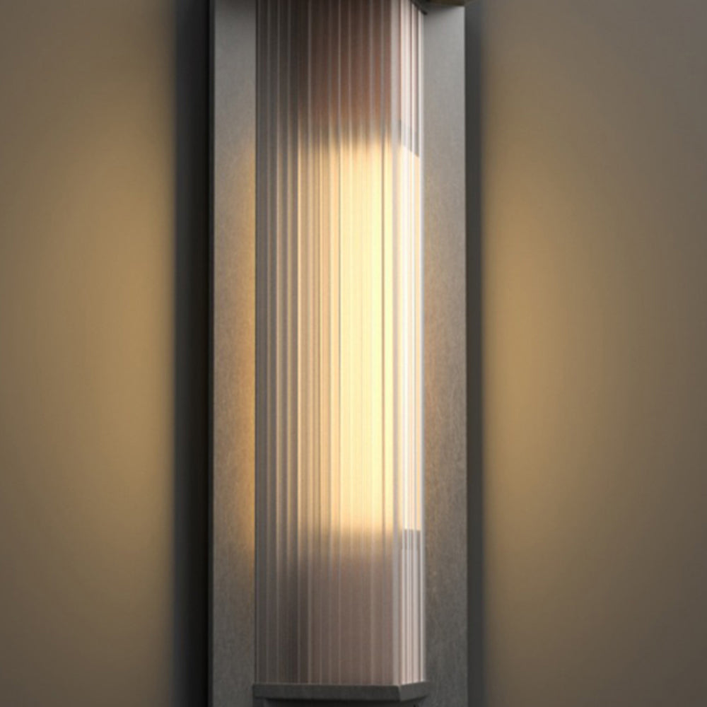 Warm light visible through Orr vertically ribbed shade