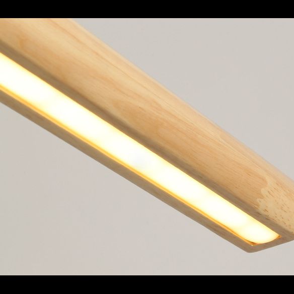 Close-up of the illuminated strip beneath wood-tone pendant