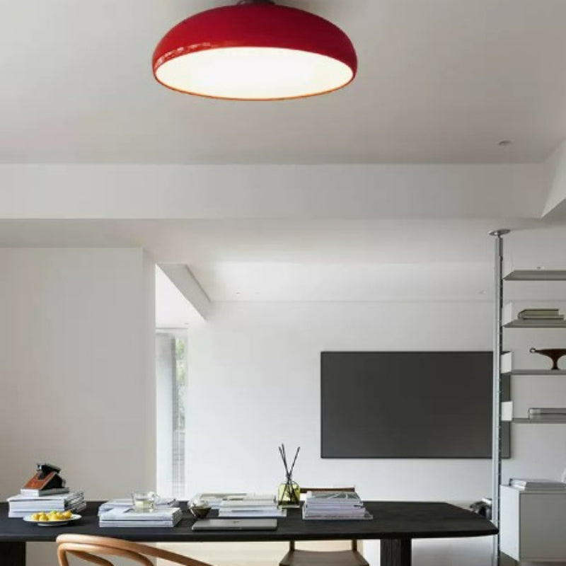 Red Morandi ceiling light above a dining table