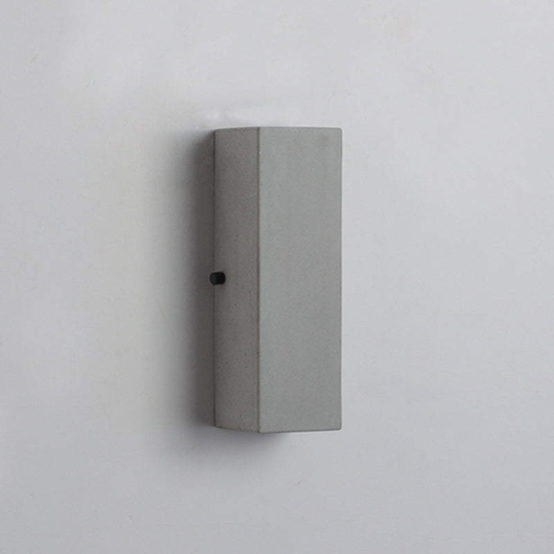 Tall unlit cement block mounted vertically
