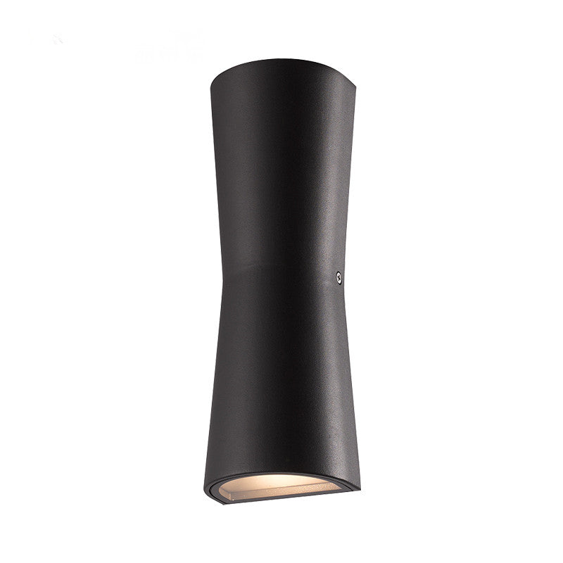 Black Orr wall lamp with a curved narrow middle and illuminated oval lower opening.