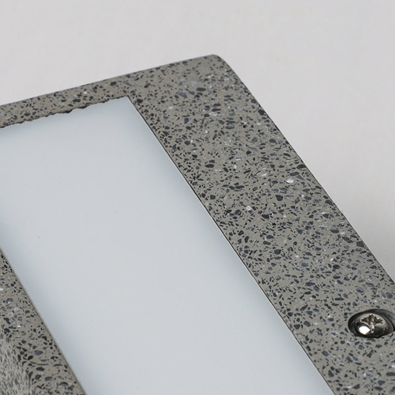 Edge diffuser panel with speckled border and visible fixing screw