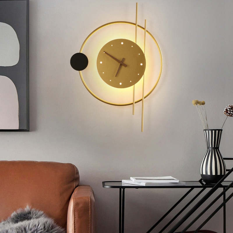 Gold wall-clock lamp above a sofa