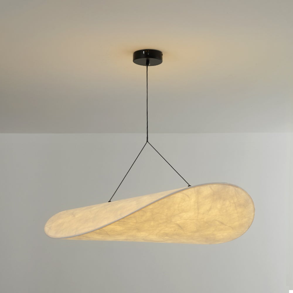 Glowing curved white shade with visible surface texture, black suspension and a round black ceiling canopy
