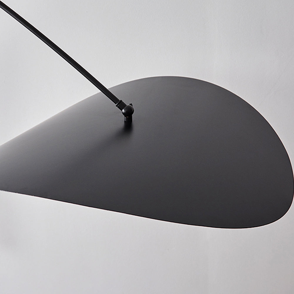 Close view of a black leaf-shaped shade and its metal joint