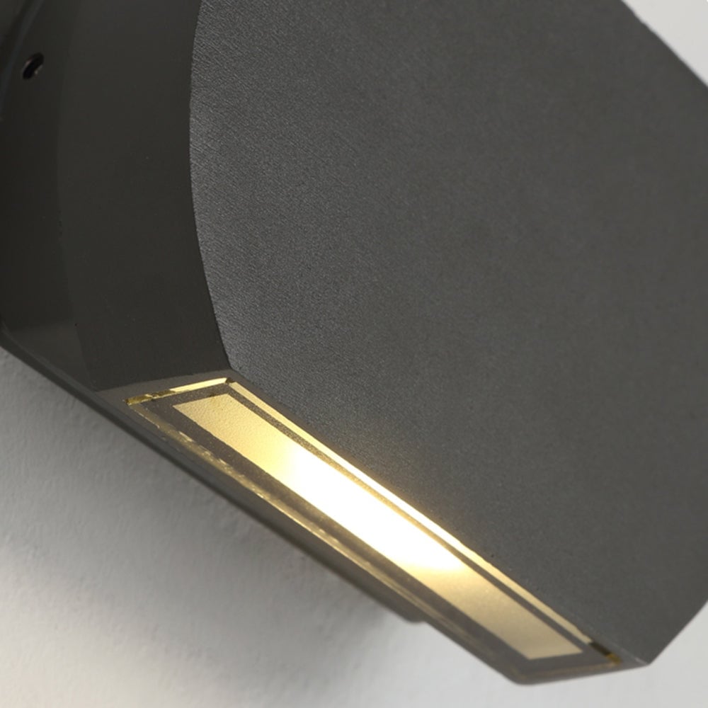 Close view of the illuminated lower light window on Orr wall lamp
