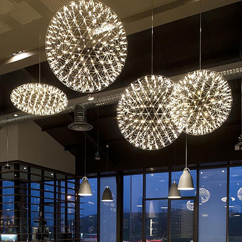 Glowing spherical decorative pendants in a dining interior