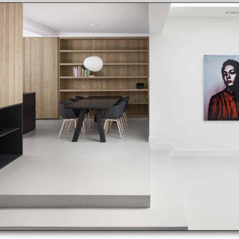 Small white pendant in a dining nook with wall shelving