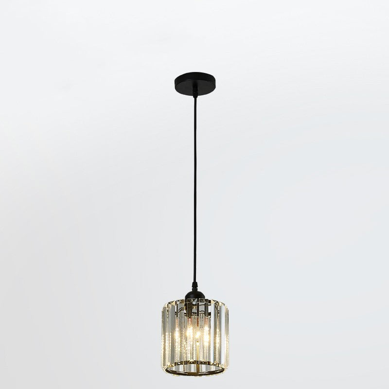 Single black Herbert cylindrical glass pendant with a round canopy against white