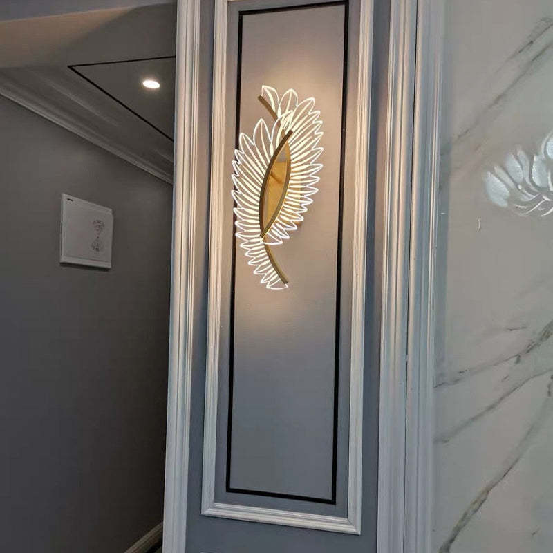 Kristy overlapping wing wall light on a framed hallway panel beside a doorway