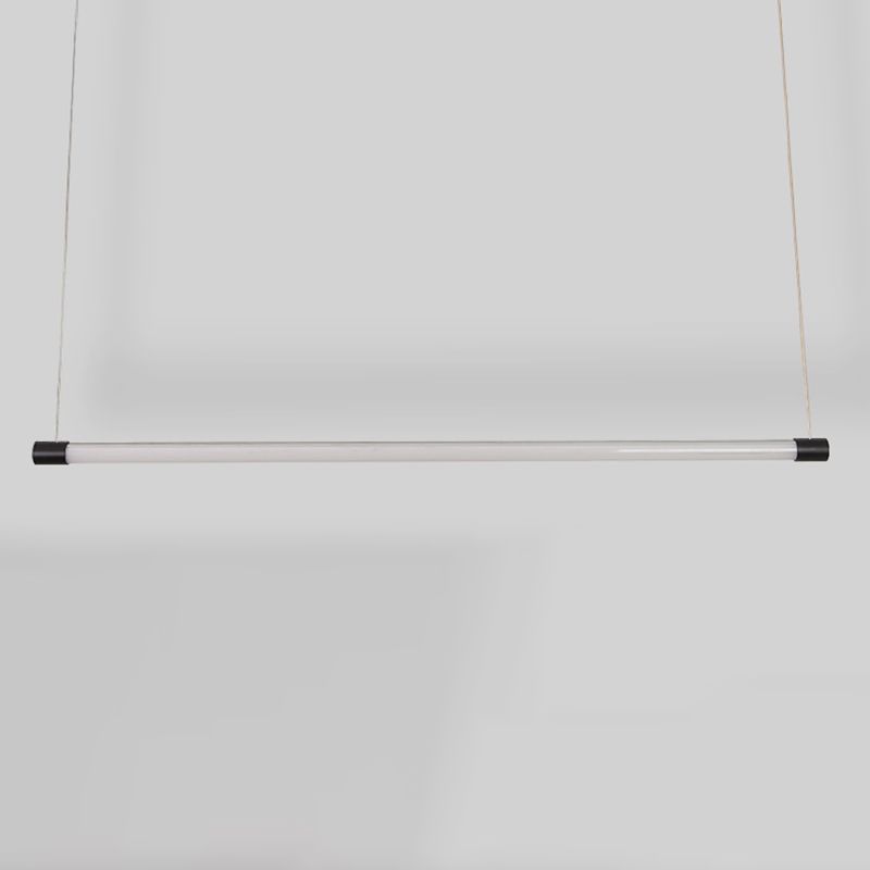 Front view of a black-ended tube pendant with a pale centre against a grey background
