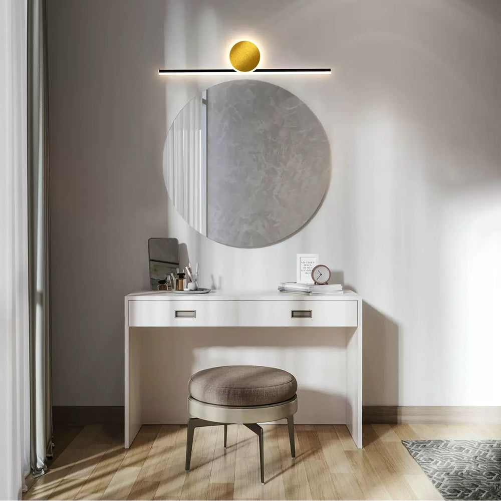 Emyr horizontal disc and bar wall light above a round mirror and white dressing table