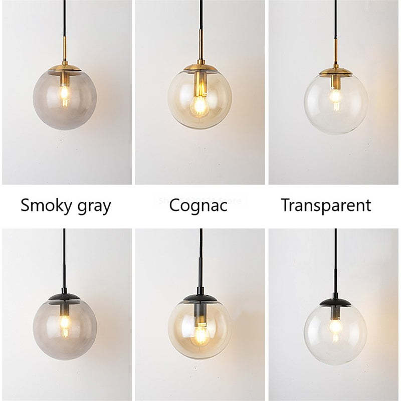 Comparison of Gold and Black globe wall lights with glass labelled Smoky gray, Cognac and Transparent