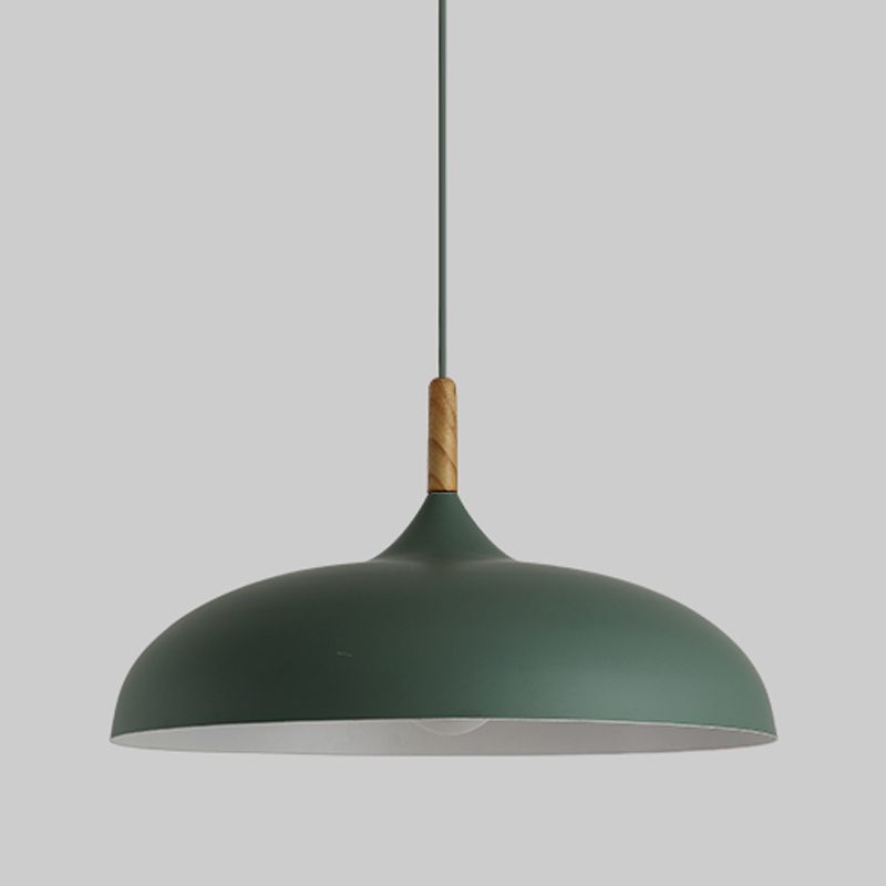 Green wide dome pendant with a wood-grain-look collar and dark cord